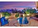 A picturesque pool area is set against a backdrop of vibrant landscaping and a tranquil ambiance at 708 Kibbey St, Las Vegas, NV 89178