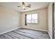 The bedroom includes light walls, gray vinyl floors, and a window allowing natural light at 7083 Somera Way, Las Vegas, NV 89113