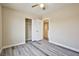 This bedroom includes gray vinyl floors, a ceiling fan, and access to a closet at 7083 Somera Way, Las Vegas, NV 89113