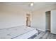 This bedroom features neutral walls, gray flooring, and a ceiling fan at 7083 Somera Way, Las Vegas, NV 89113