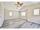 Spacious bedroom with wood floors and a ceiling fan at 7083 Somera Way, Las Vegas, NV 89113