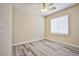 Clean bedroom with ceiling fan, neutral walls, updated flooring and natural lighting at 7083 Somera Way, Las Vegas, NV 89113