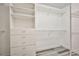 Spacious walk-in closet featuring custom shelving and drawers for optimal organization at 7083 Somera Way, Las Vegas, NV 89113