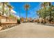 Gated community entrance with sign and landscaping provides security and aesthetic appeal at 7083 Somera Way, Las Vegas, NV 89113