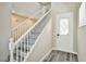 Entryway with a stairway and light gray wood floors and a decorated glass front door at 7083 Somera Way, Las Vegas, NV 89113