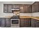 Modern kitchen featuring stainless steel stove and oven, with lots of cabinet space at 7083 Somera Way, Las Vegas, NV 89113