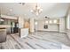 Spacious living area boasts sleek floors, a modern kitchen, and cozy fireplace at 7083 Somera Way, Las Vegas, NV 89113