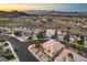 A charming two-story home situated on a corner lot in a desert neighborhood with city and mountain views at 722 Descartes Ave, Henderson, NV 89002
