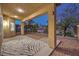 Covered back patio with a zebra rug, desert landscaping, and sunset views at 722 Descartes Ave, Henderson, NV 89002