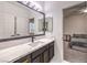 Bathroom featuring marble counters and modern fixtures adjoining the bedroom for convenience and style at 722 Descartes Ave, Henderson, NV 89002