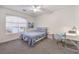 Bright bedroom with a full size bed, desk, and large window providing ample natural light at 722 Descartes Ave, Henderson, NV 89002