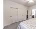 Bright bedroom showcasing a large closet, ceiling fan, and neutral color scheme for a relaxing atmosphere at 722 Descartes Ave, Henderson, NV 89002