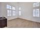Bright bedroom with ample natural light from multiple windows and wood-look flooring at 722 Descartes Ave, Henderson, NV 89002