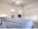 Spacious bedroom with two access doors and neutral carpet; also features a ceiling fan at 722 Descartes Ave, Henderson, NV 89002