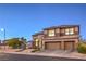 Attractive house featuring a three-car garage, desert landscaping, and an arched front entry at 722 Descartes Ave, Henderson, NV 89002