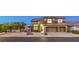 Lovely two-story home featuring a three-car garage, neutral-toned exterior, and beautiful desert landscaping at 722 Descartes Ave, Henderson, NV 89002