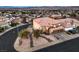 Charming two-story home with a Spanish tile roof, a two car garage, and desert landscaping at 722 Descartes Ave, Henderson, NV 89002