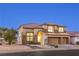 Charming home boasts an attached three-car garage, landscaped front yard, and elegant architectural details at 722 Descartes Ave, Henderson, NV 89002
