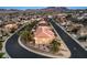 A charming two-story home situated on a corner lot in a desert neighborhood with mountain views at 722 Descartes Ave, Henderson, NV 89002