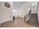Bright open foyer features high ceilings, wood floors, and a staircase at 722 Descartes Ave, Henderson, NV 89002