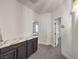 Hallway with modern storage and views into rooms with a marble countertop and elegant finishes at 722 Descartes Ave, Henderson, NV 89002