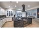 Modern kitchen with a large island, stainless steel appliances, and granite countertops for food prep at 722 Descartes Ave, Henderson, NV 89002