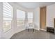 Corner of the main bedroom with large windows, natural light, and stylish furniture at 722 Descartes Ave, Henderson, NV 89002