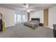 Spacious main bedroom features a modern ceiling fan, carpet flooring, and stylish paneled accent walls at 722 Descartes Ave, Henderson, NV 89002