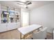 Bright and airy office with built-in shelving, storage, and a sleek desk with gold accents at 722 Descartes Ave, Henderson, NV 89002