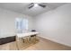 Bright office space featuring a stylish desk, modern ceiling fan, and bright natural light at 722 Descartes Ave, Henderson, NV 89002