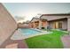 Private backyard featuring a refreshing pool, covered patio, and low-maintenance landscaping for easy outdoor living at 7235 Summer Air Ave, Las Vegas, NV 89179