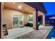 Backyard view featuring a covered patio, sliding glass door, BBQ and sparkling pool for leisure at 7235 Summer Air Ave, Las Vegas, NV 89179