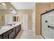 Bathroom features double sinks and glass enclosed shower at 7235 Summer Air Ave, Las Vegas, NV 89179