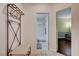 Bright bathroom featuring a tiled floor, bathtub, and an elegant bench rack at 7235 Summer Air Ave, Las Vegas, NV 89179