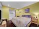 Bedroom with bedside table and television at 7235 Summer Air Ave, Las Vegas, NV 89179