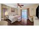 Bedroom showcases a ceiling fan, slider doors to the backyard, and neutral decor at 7235 Summer Air Ave, Las Vegas, NV 89179
