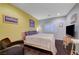 Bedroom featuring wood floors and a chair at 7235 Summer Air Ave, Las Vegas, NV 89179
