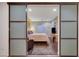 Cozy bedroom setup with sliding door access at 7235 Summer Air Ave, Las Vegas, NV 89179