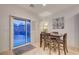 Dining area adjacent to the patio, featuring sliding glass doors and a modern dining table at 7235 Summer Air Ave, Las Vegas, NV 89179
