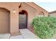Close-up of the home's gated entry, showcasing its unique design and inviting aesthetic at 7235 Summer Air Ave, Las Vegas, NV 89179