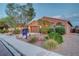 Charming single-story house with manicured desert landscaping, and a RE sign at 7235 Summer Air Ave, Las Vegas, NV 89179