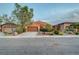 Charming single-story house with a large driveway and low-maintenance desert landscaping at 7235 Summer Air Ave, Las Vegas, NV 89179