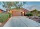 Inviting single-story house featuring desert landscaping, and an extra long driveway at 7235 Summer Air Ave, Las Vegas, NV 89179