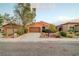 Inviting single-story home with desert landscaping, a two-car garage, and a welcoming front entrance at 7235 Summer Air Ave, Las Vegas, NV 89179