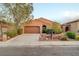 Beautiful single-story home showcasing desert landscaping, a two-car garage, and a pleasant facade at 7235 Summer Air Ave, Las Vegas, NV 89179