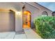 Close-up of the front entrance showcasing a custom iron security gate and desert landscaping at 7235 Summer Air Ave, Las Vegas, NV 89179