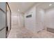 Hallway boasts tile floors, neutral walls and accent doors at 7235 Summer Air Ave, Las Vegas, NV 89179