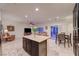 Open kitchen flows into living area, features an island and a seamless integration at 7235 Summer Air Ave, Las Vegas, NV 89179