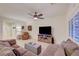 Comfortable living room with tile floors, a modern TV, and a large sectional sofa at 7235 Summer Air Ave, Las Vegas, NV 89179
