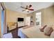 Comfortable main bedroom with ceiling fan and open bathroom entrance at 7235 Summer Air Ave, Las Vegas, NV 89179